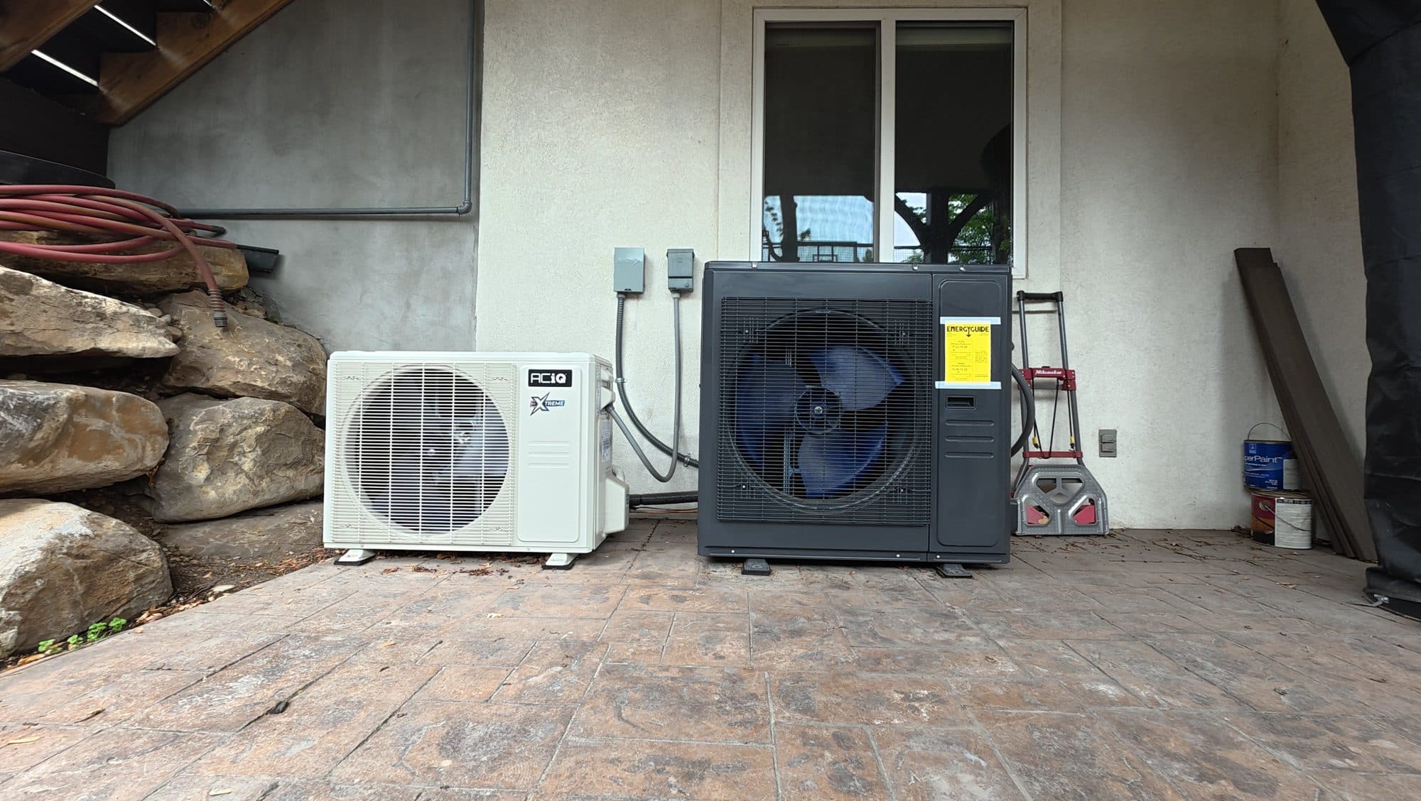 Mini-split condenser and heat pump installed on a patio