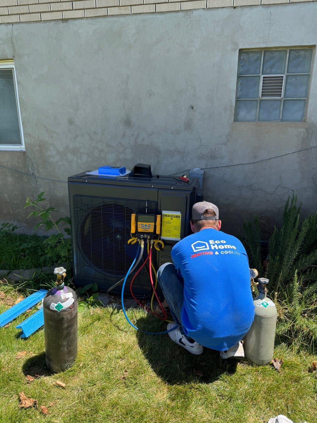 Eco Home technician commissioning a variable-speed heat pump at an American Fork home