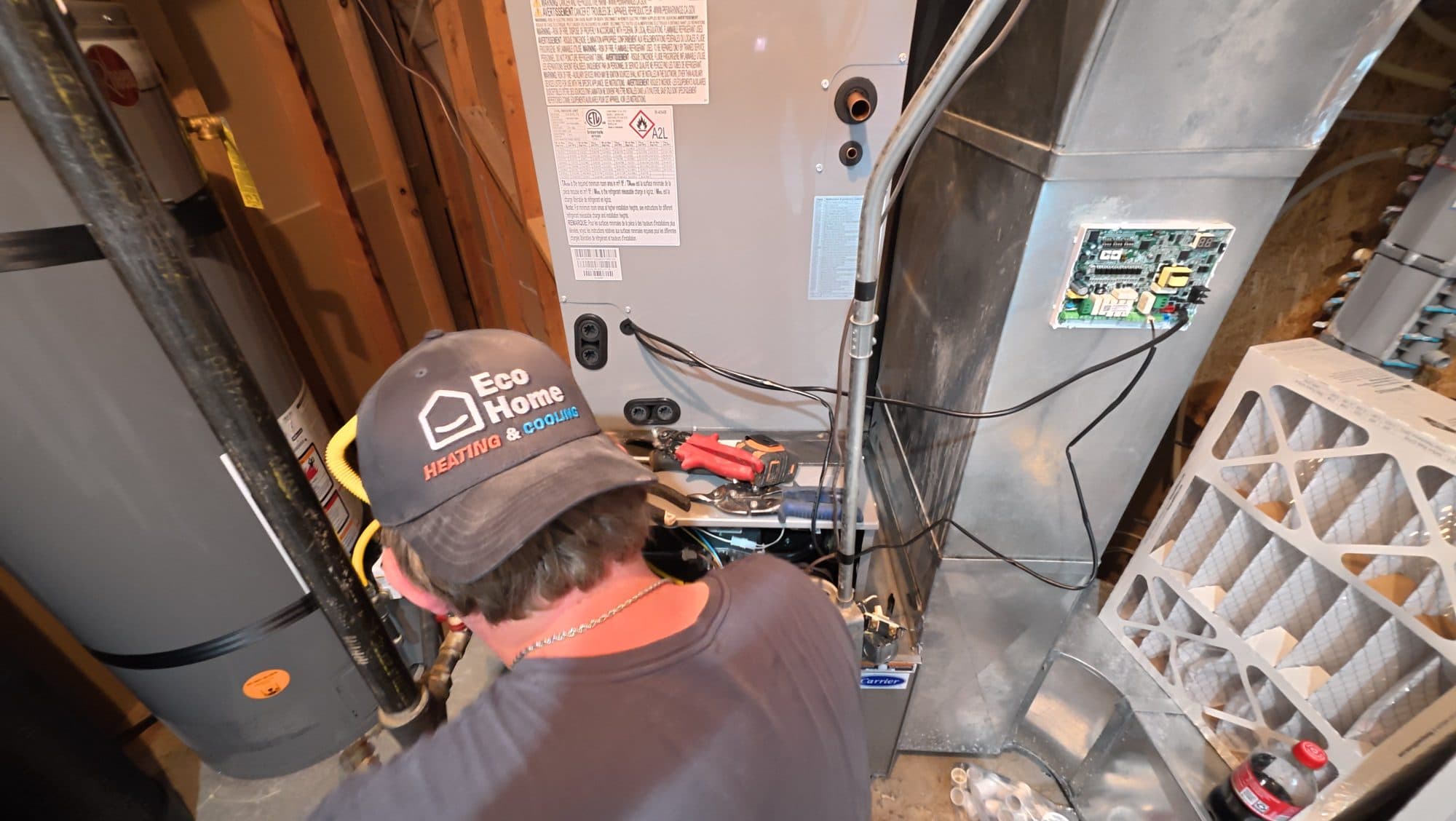 Technician inspecting a furnace