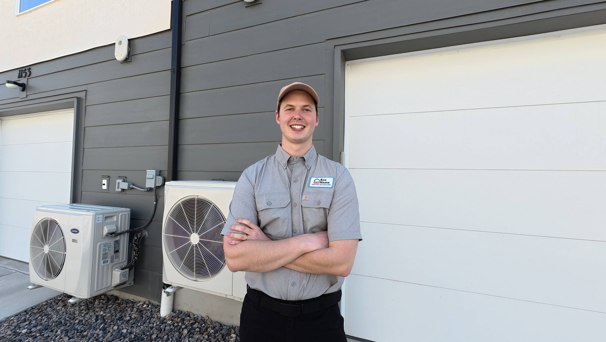 Technician in front of an air conditioner replacement in American Fork, Utah.